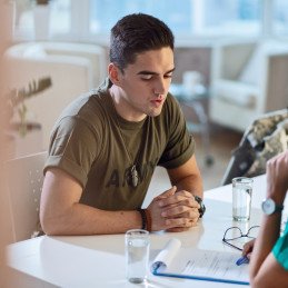 veteran smiling in therapy setting