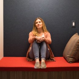 woman sitting in booth