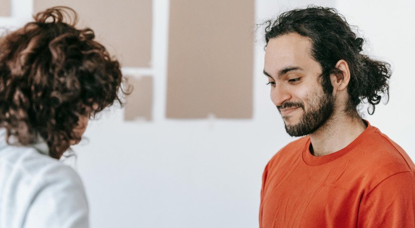 young man and woman talking