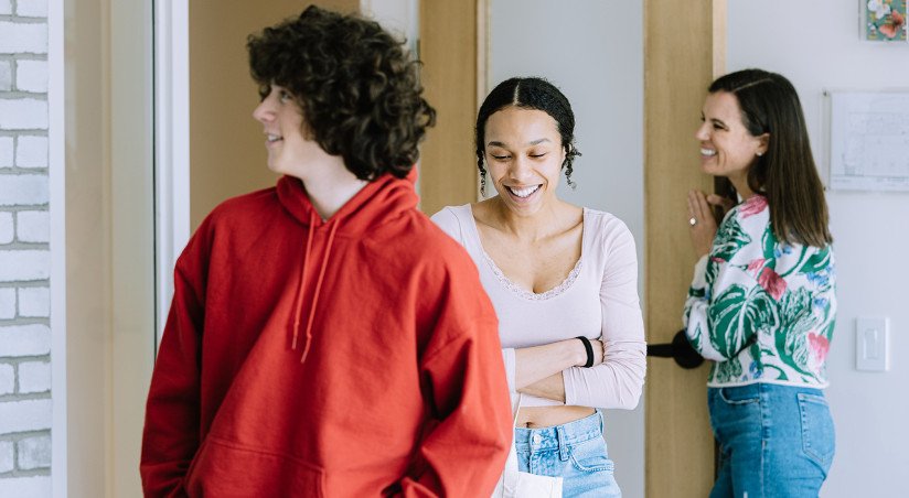 two teens leaving room with counselor