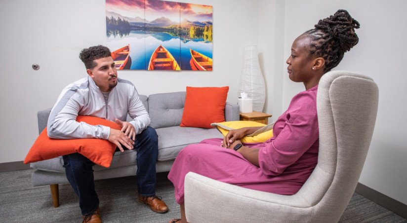 two people in therapy setting